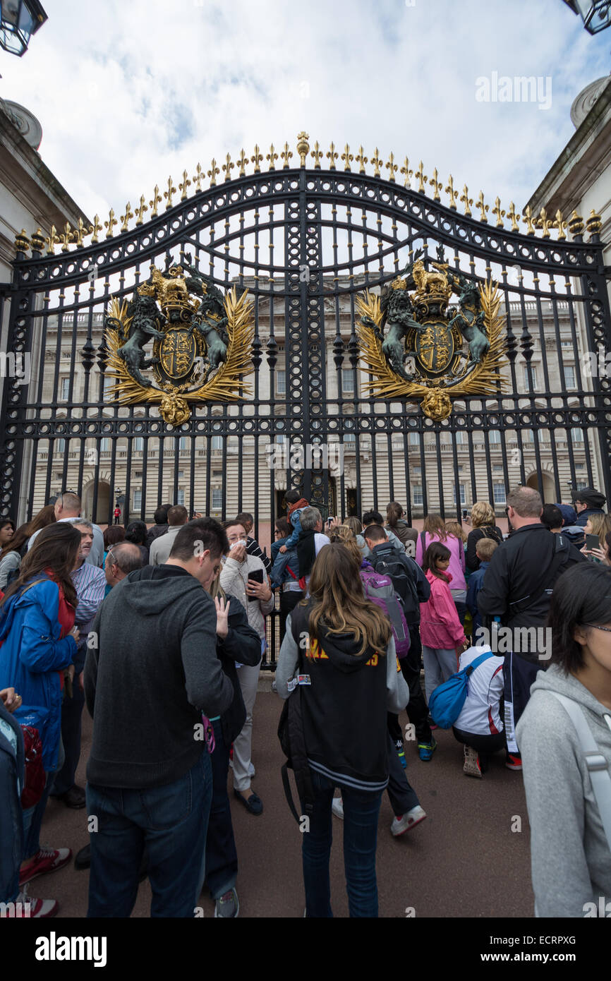 Buckingham Palace the official residence of Queen Elizabeth II and one of the major tourist destinations U.K. Entrance and main gate with lanterns Stock Photo