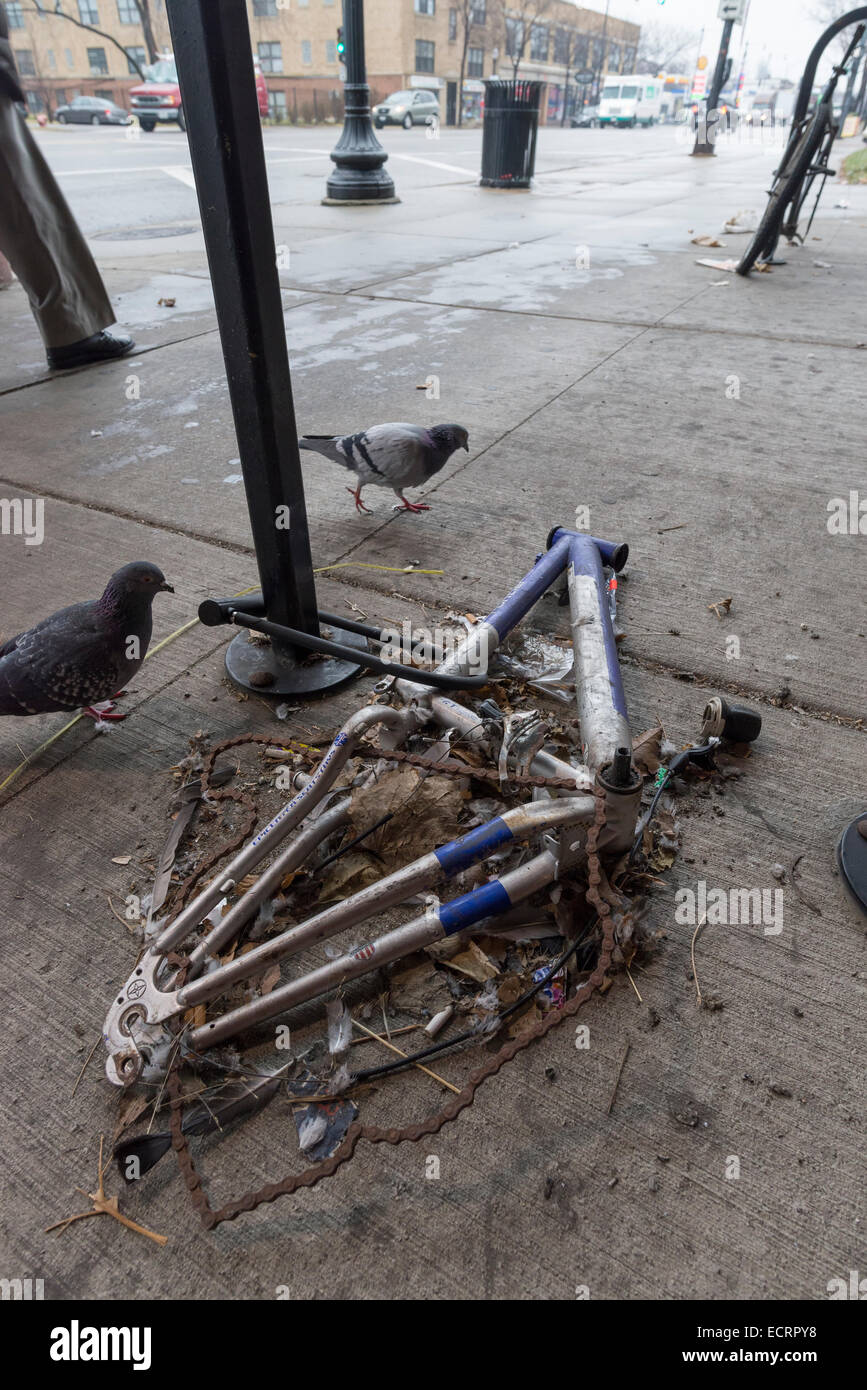 Frame from a vandalized bicycle locked to a bike rack, Chicago Stock