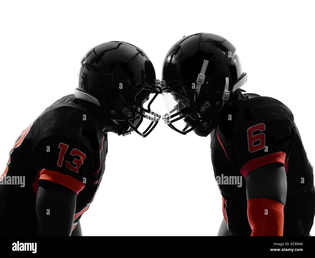 two american football players face to face in silhouette shadow on white background Stock Photo