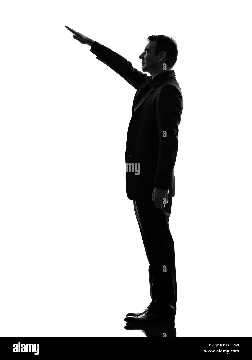 one caucasian extreme right wing man saluting in silhouette on white background Stock Photo