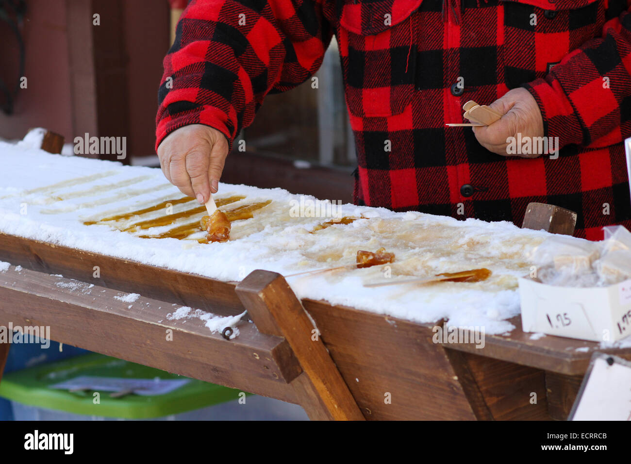 The process of making maple taffy using canadian Maple Syrup and snow Stock Photo Alamy