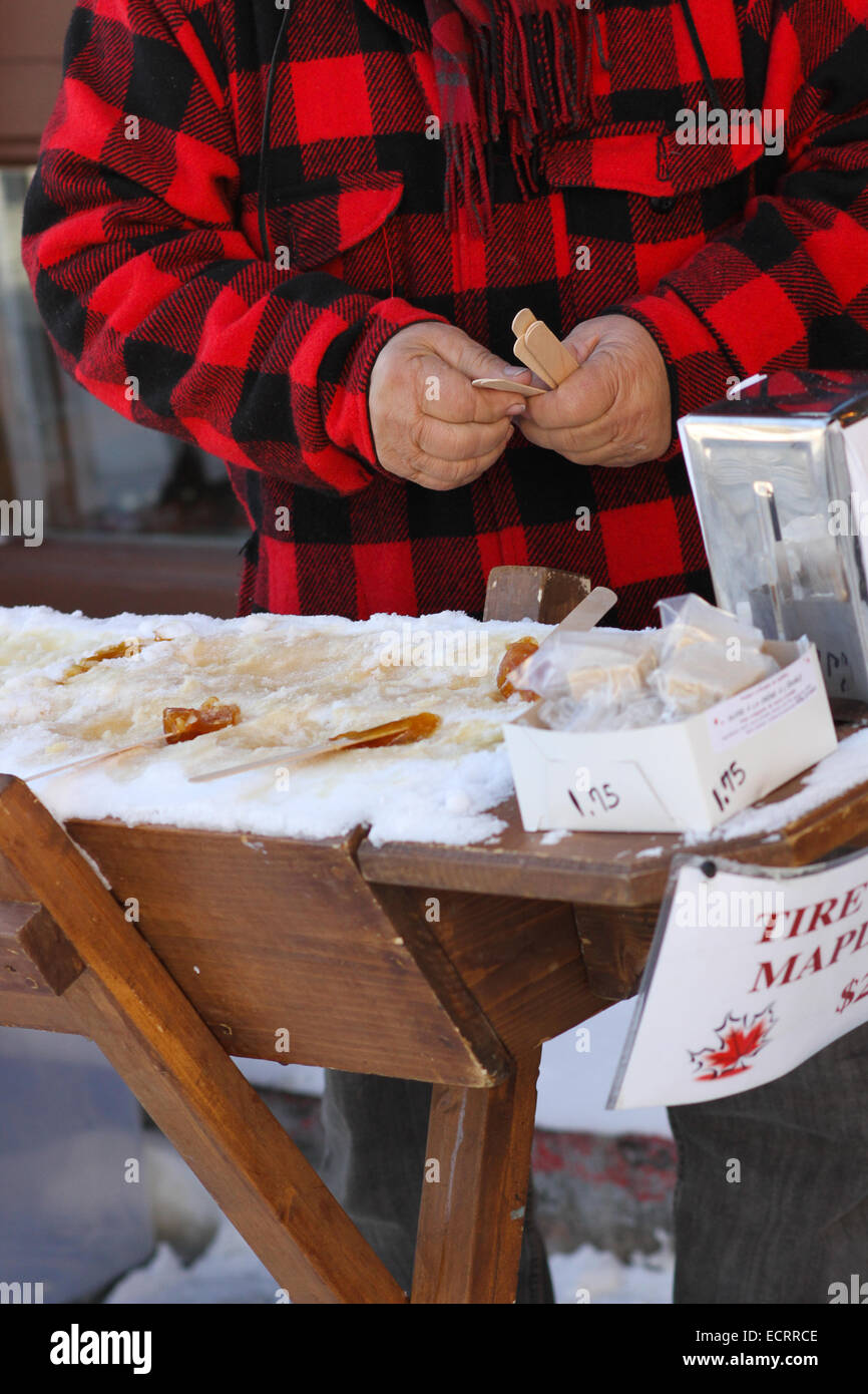 The process of making maple taffy using canadian Maple Syrup and snow Stock Photo Alamy