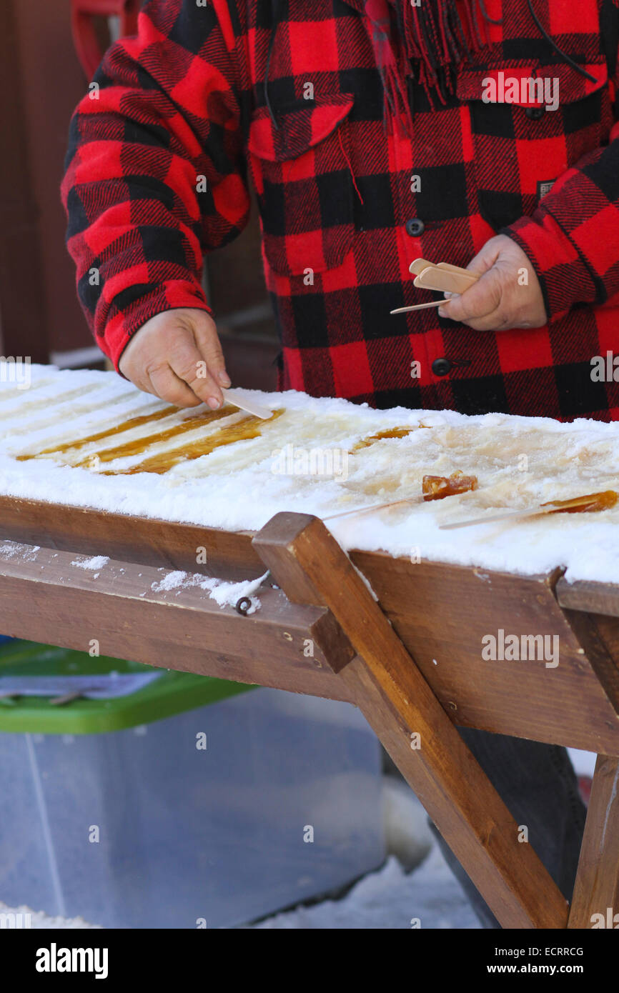 The process of making maple taffy using canadian Maple Syrup and snow Stock Photo Alamy