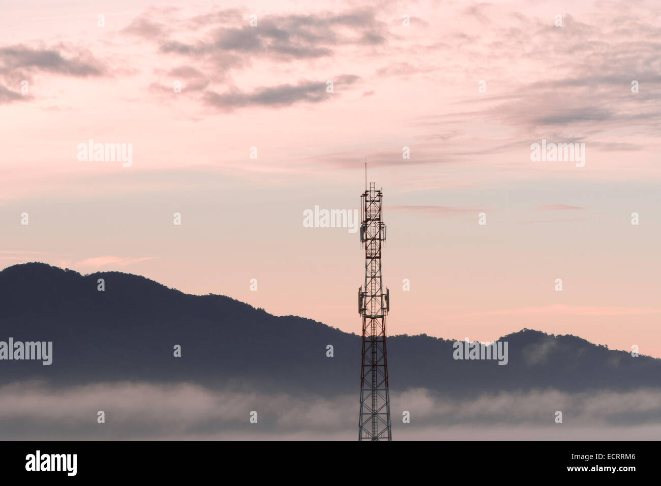 Telecommunication tower and sunset sky background Stock Photo