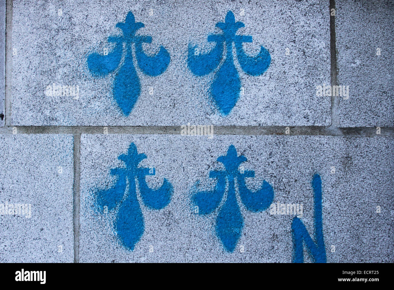 The Fleur-De-Lys spray painted on a wall in Old Quebec City. Stock Photo