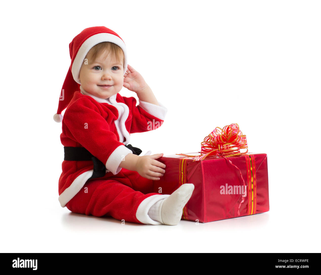 Christmas baby with box in Santa's clothes isolated on white Stock Photo