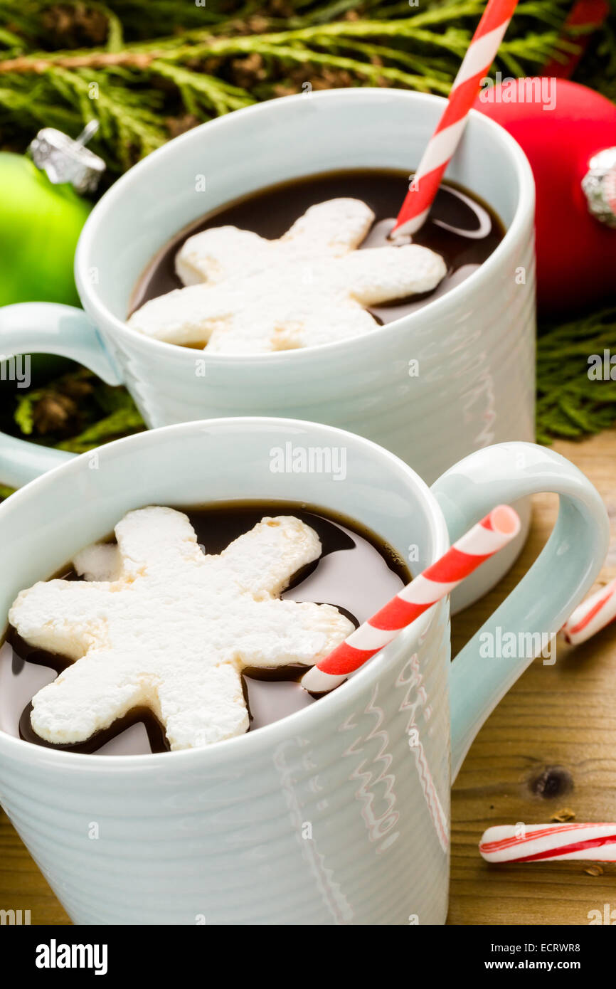 Homemade hot chocolate garnished with snowflake shaped white marshmallows. Stock Photo