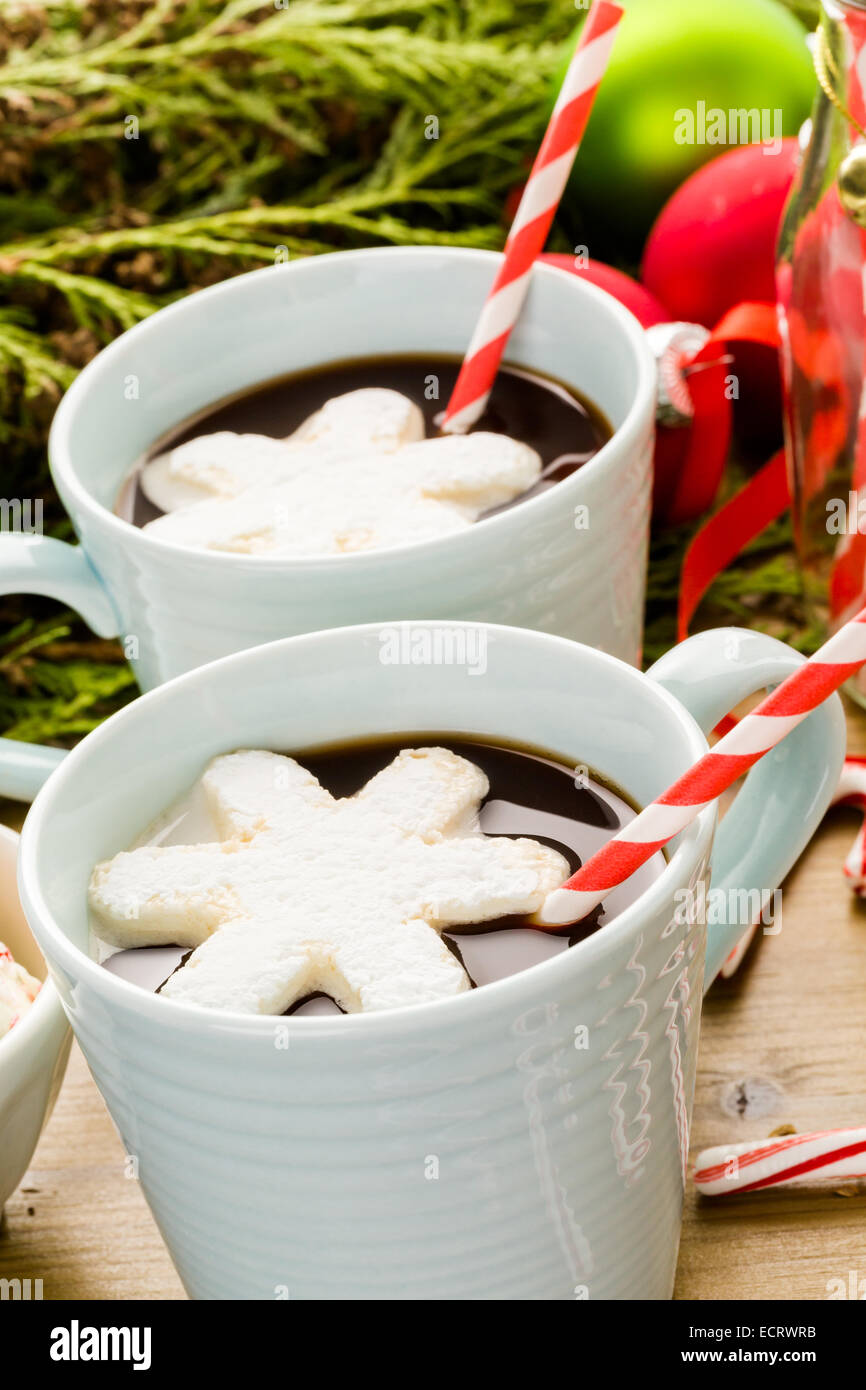 Homemade hot chocolate garnished with snowflake shaped white marshmallows. Stock Photo