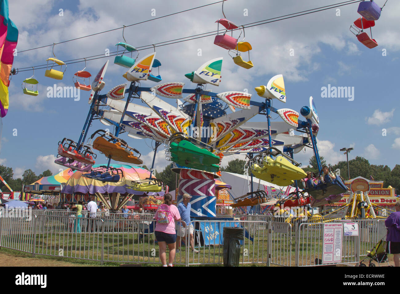 People enjoy the colorful, wild rides at the state fair Stock Photo