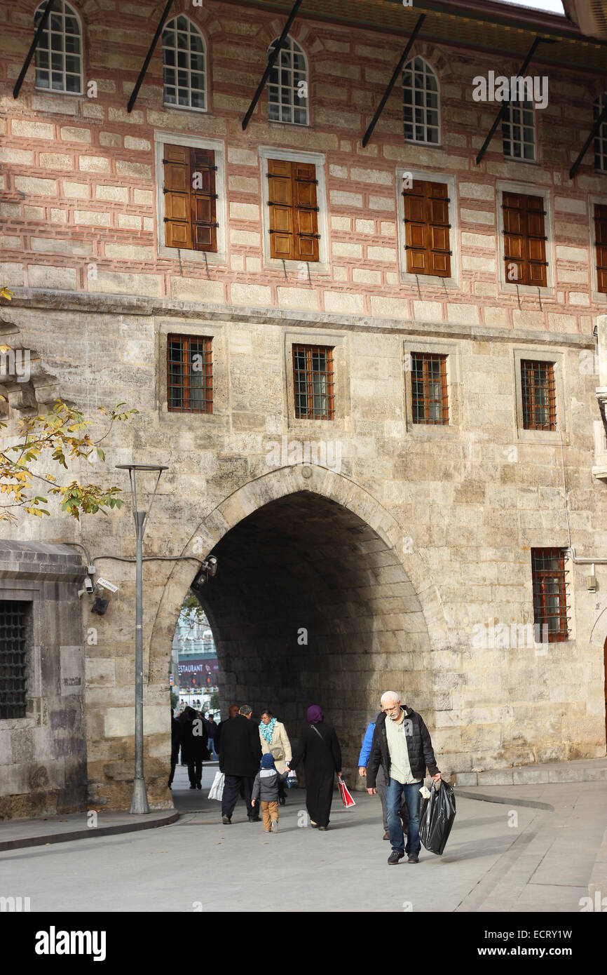 People passing through arch passage in Eminonu, close to Yeni Cami (New Mosque). Stock Photo