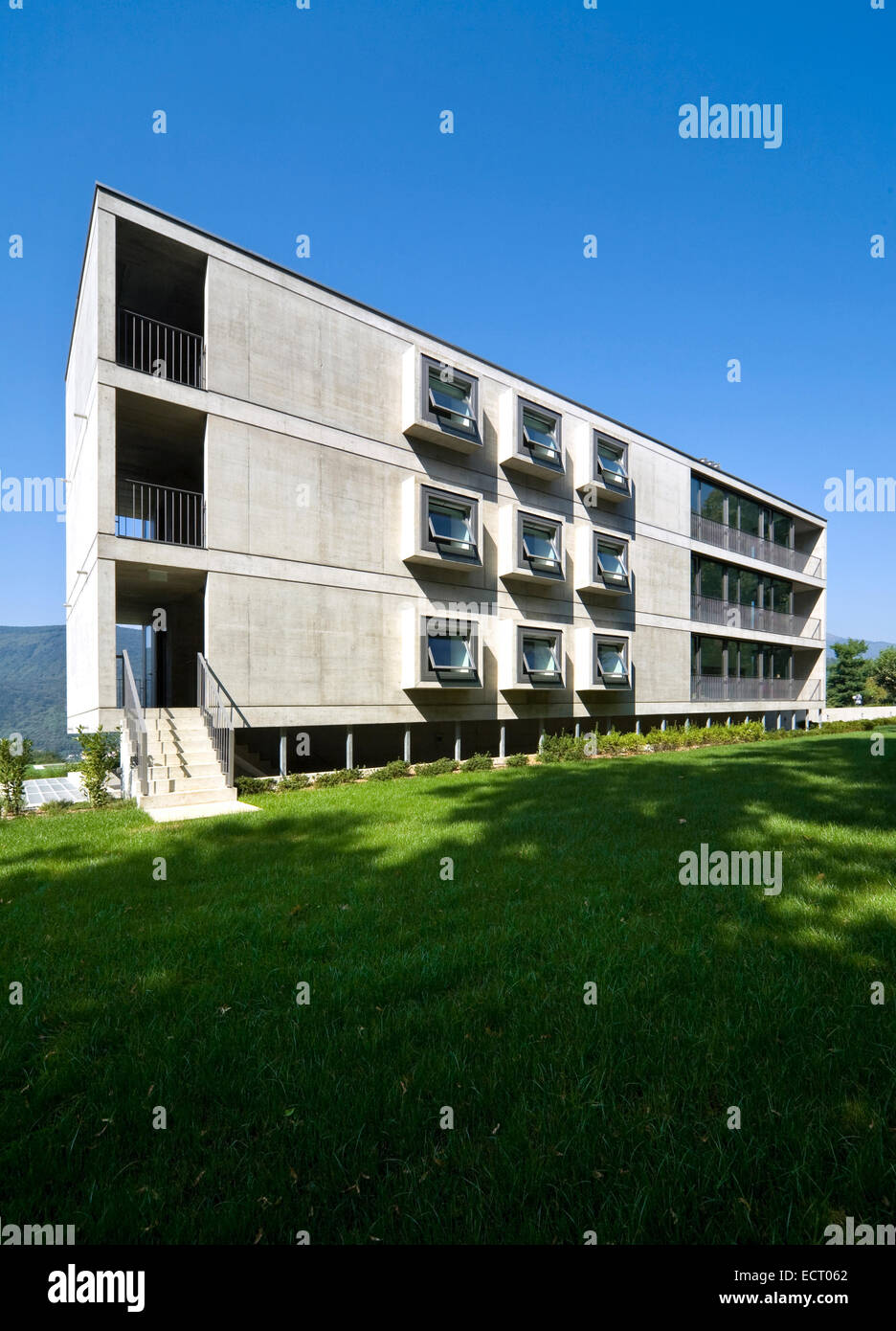 cement building exterior window grass sky Stock Photo