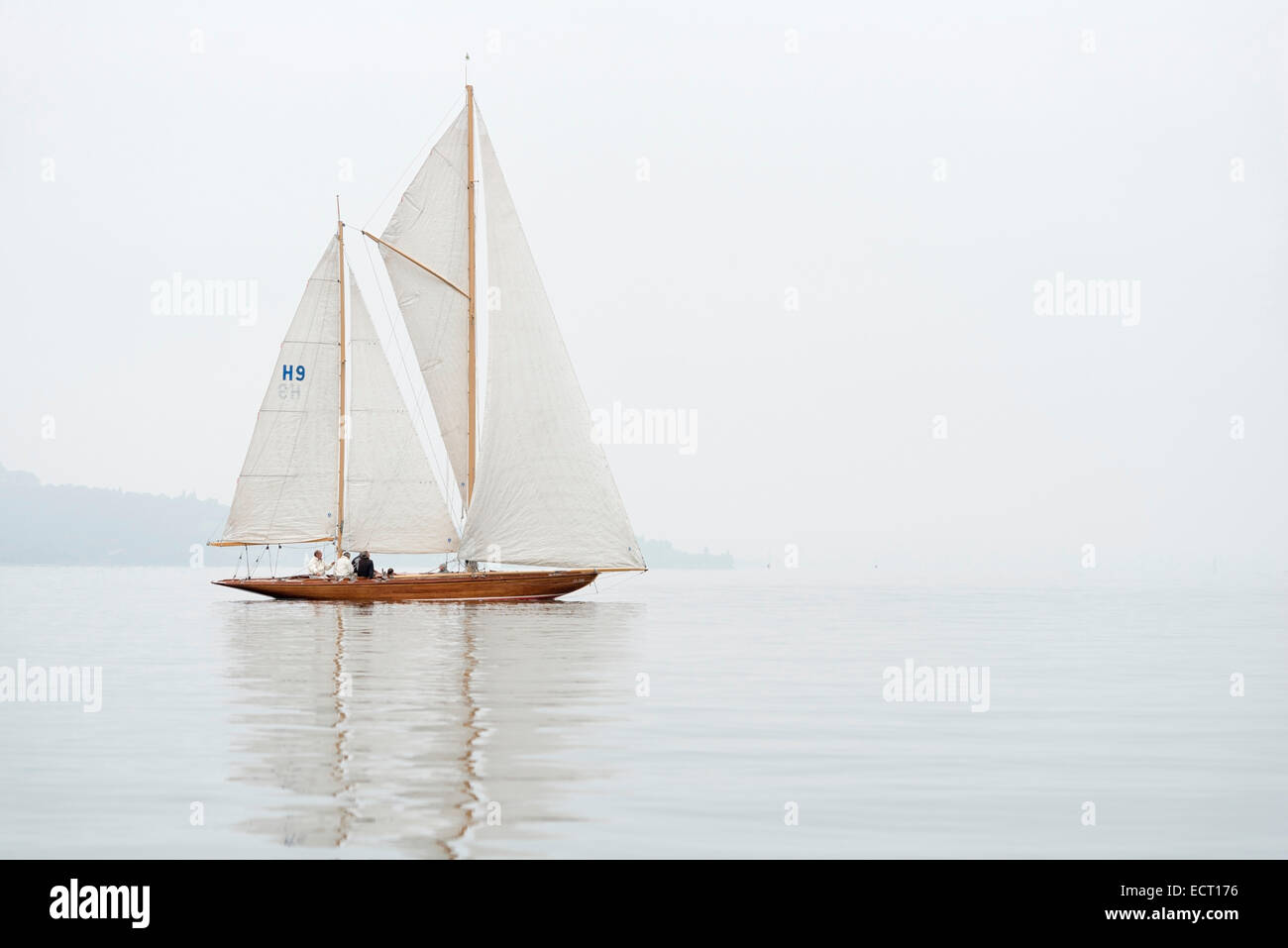Germany  Baden-Wuerttemberg  Lake Constance  sailing boat in mist near Bodman Stock Photo