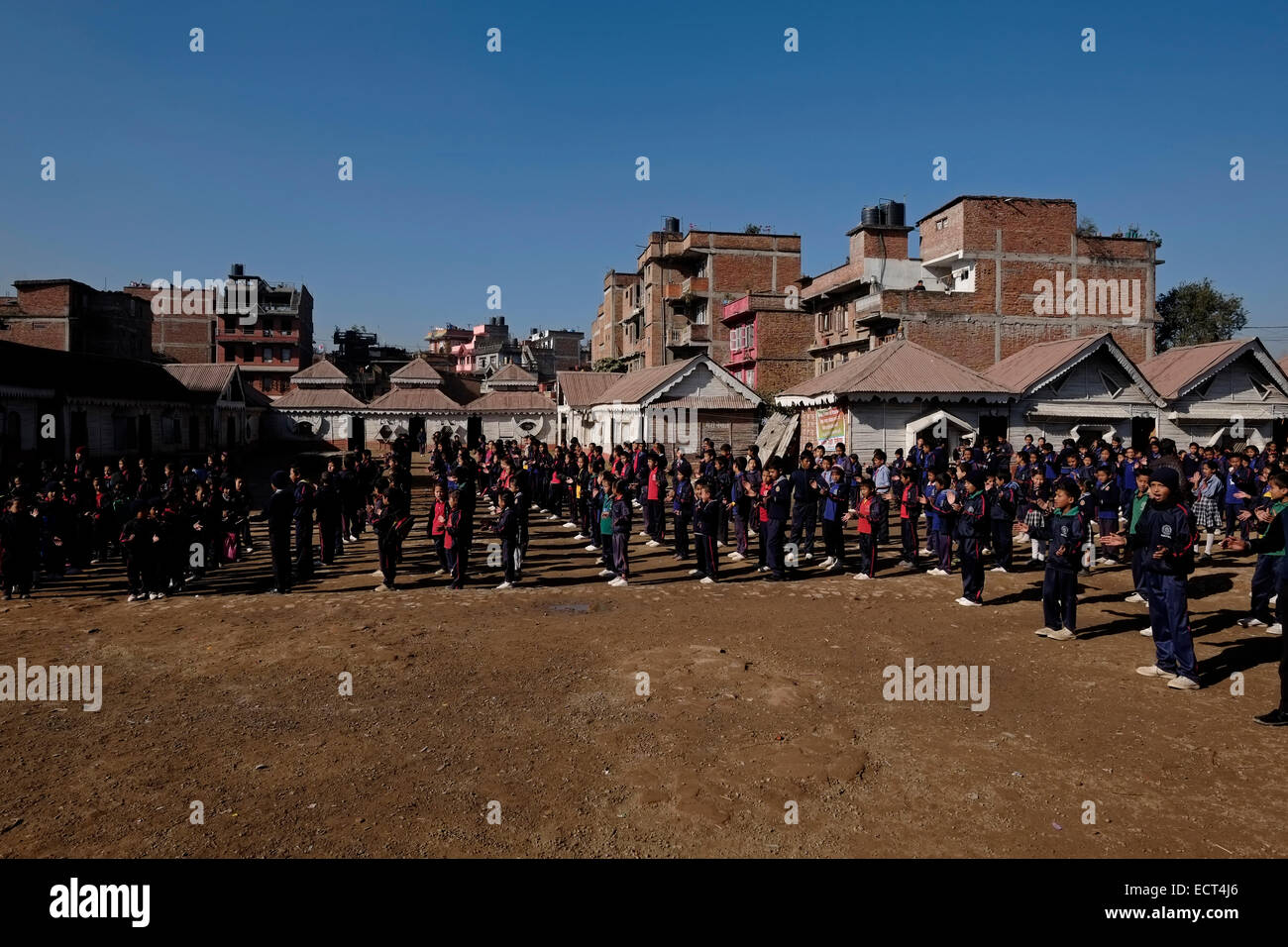 Nepalese schoolchildren standing in formation for morning assembly in school yard of Samata Shiksha Niketan elementary school which cost just 100 Nepali Rupees ($1.35) per student each month in the city of Bhaktapur Also known as Khwopa in Nepal Stock Photo