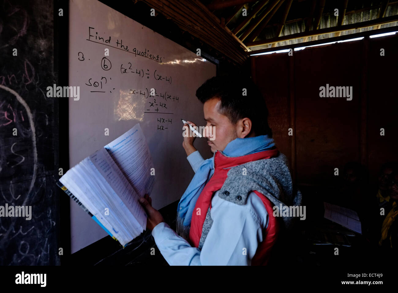 A teacher teaching mathematics in Samata Shiksha Niketan elementary school which cost just 100 Nepali Rupees ($1.35) per student each month in the city of Bhaktapur Also known as Khwopa in Nepal Stock Photo