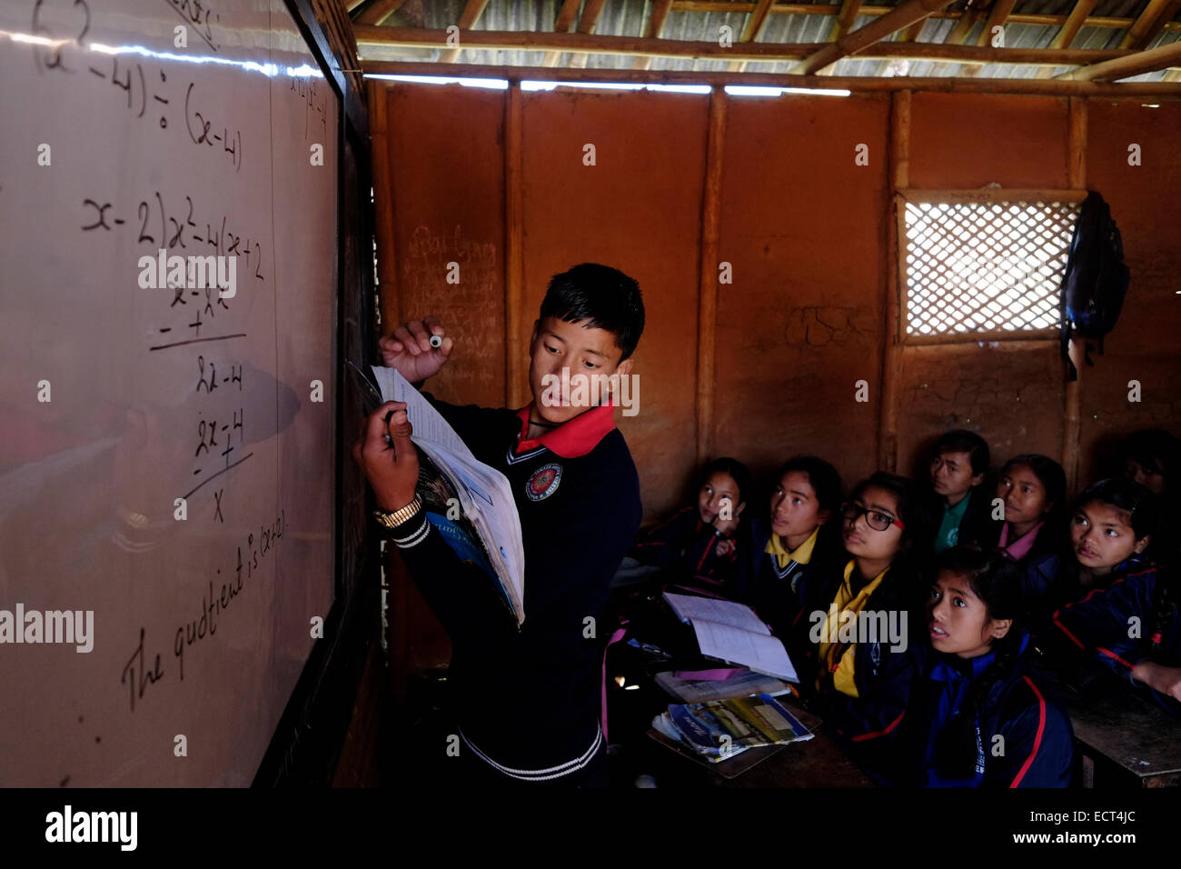Schoolchildren learning mathematics in a classroom at Samata Shiksha Niketan elementary school which cost just 100 Nepali Rupees ($1.35) per student each month in the city of Bhaktapur Also known as Khwopa in Nepal Stock Photo