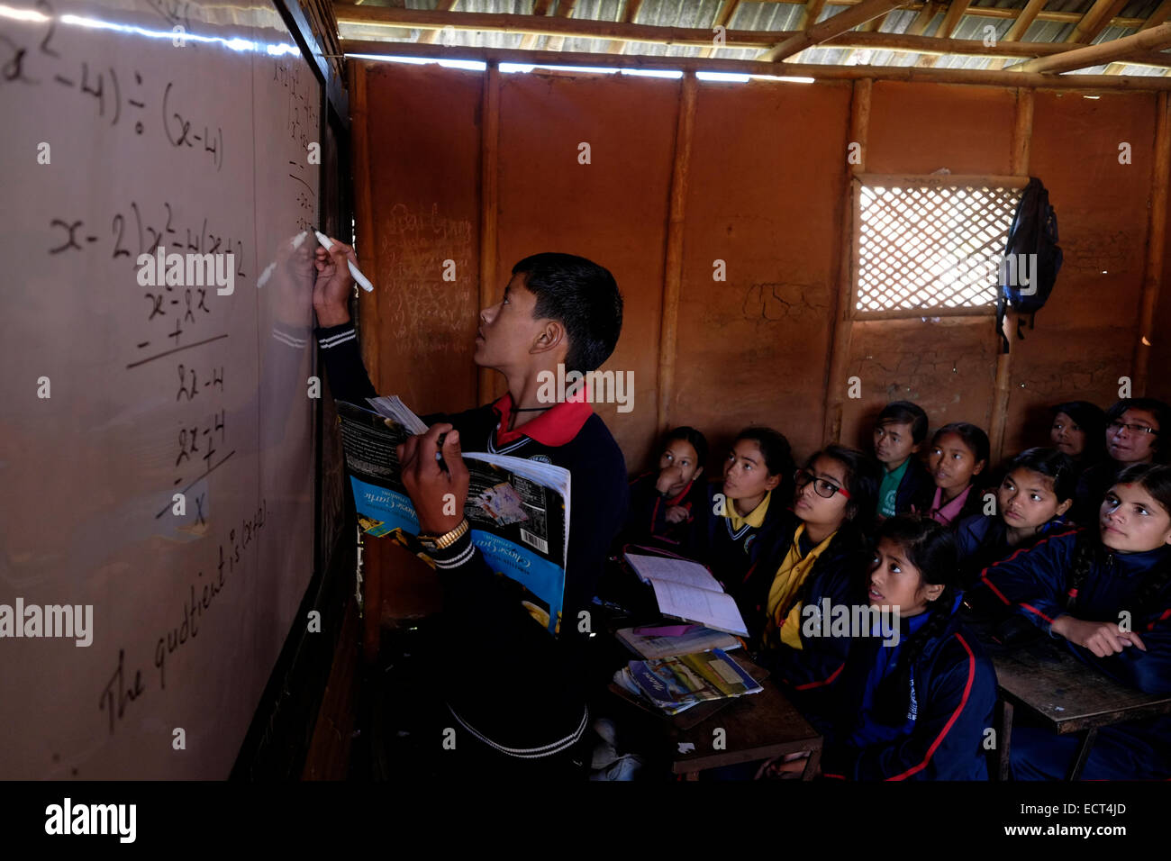 Schoolchildren learning mathematics in a classroom at Samata Shiksha Niketan elementary school which cost just 100 Nepali Rupees ($1.35) per student each month in the city of Bhaktapur Also known as Khwopa in Nepal Stock Photo