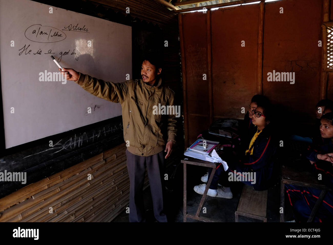 A teacher lecturing English in a classroom at Samata Shiksha Niketan elementary school which cost just 100 Nepali Rupees ($1.35) per student each month in the city of Bhaktapur Also known as Khwopa in Nepal Stock Photo