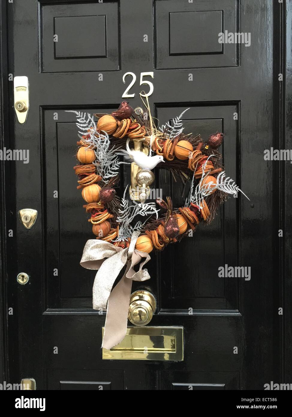 A Christmas decorative wreath on a door in Belgravia, London UK. Stock Photo