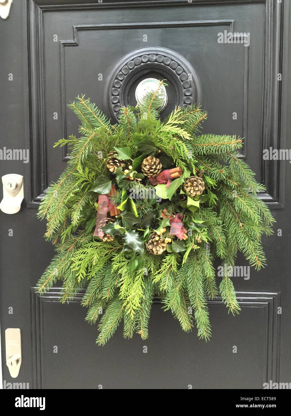 A Christmas decorative wreath on a door in Belgravia, London UK. Stock Photo