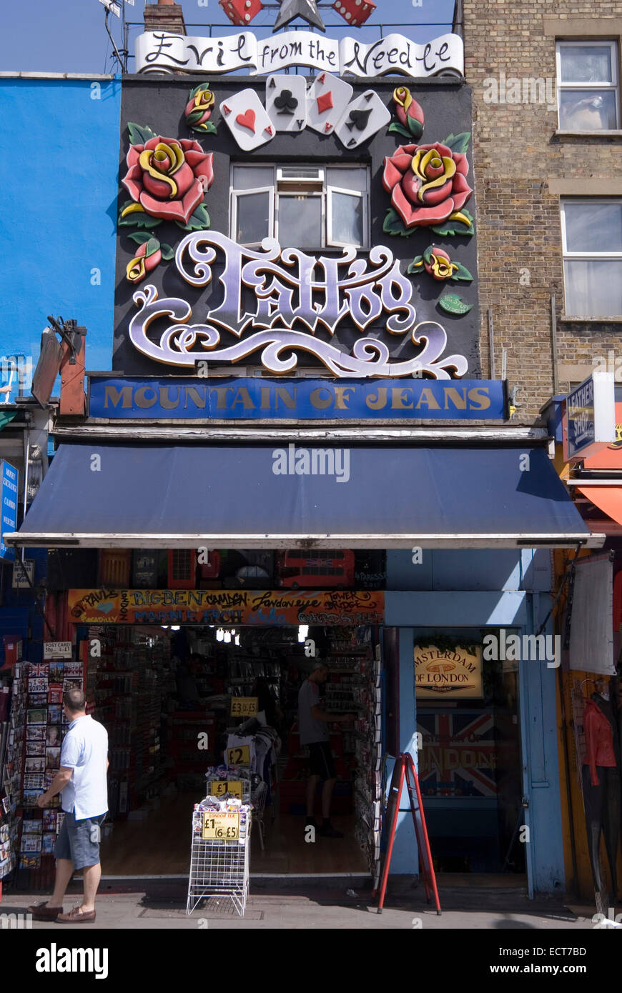 London 21 Aug 2013 : Evil from the Needle Tattoo parlour above Mountain of Jeans clothes store, 232 Camden High Street, London Stock Photo - Alamy