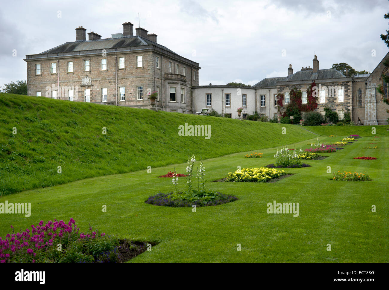 Looking across the formal planting towards the house wing and chapel of ...