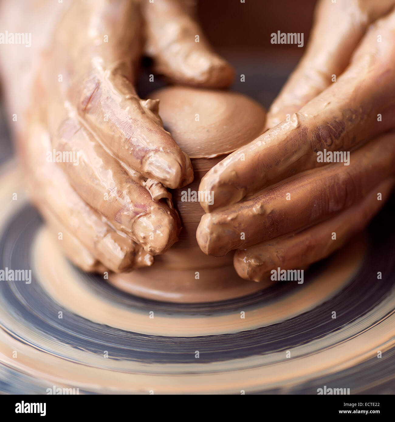 Hands working on pottery wheel Stock Photo Alamy