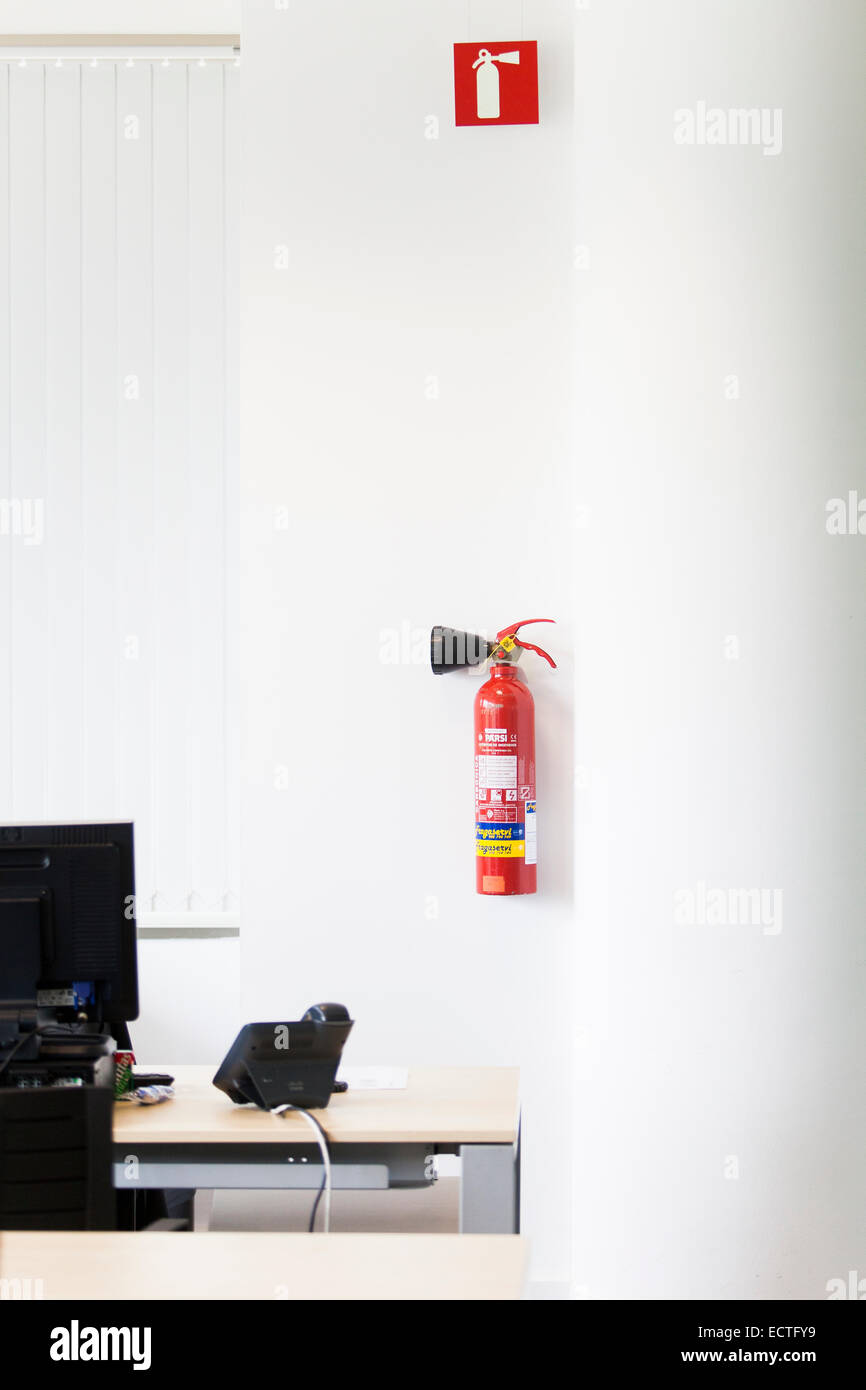 Fire extinguisher in an office Stock Photo