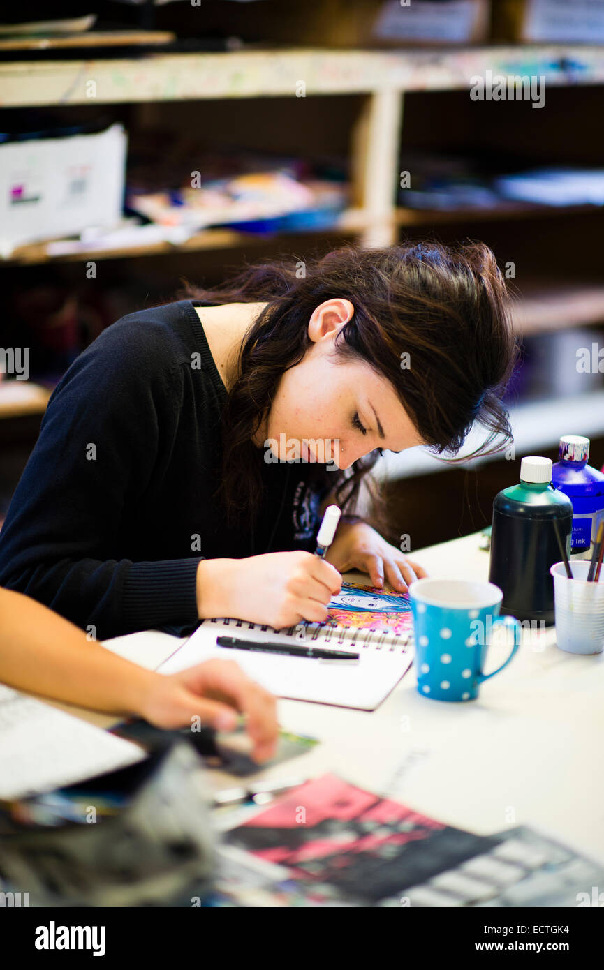 Secondary school education Wales UK:  a year 12 teenage girl working  drawing in an A Level  art class lesson Stock Photo
