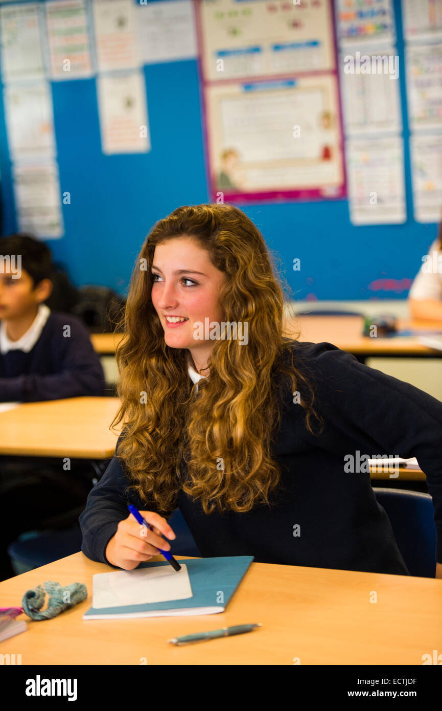 Secondary school mathematics education Wales UK: a long-haired teenage schoolgirl in a classroom class lesson Stock Photo