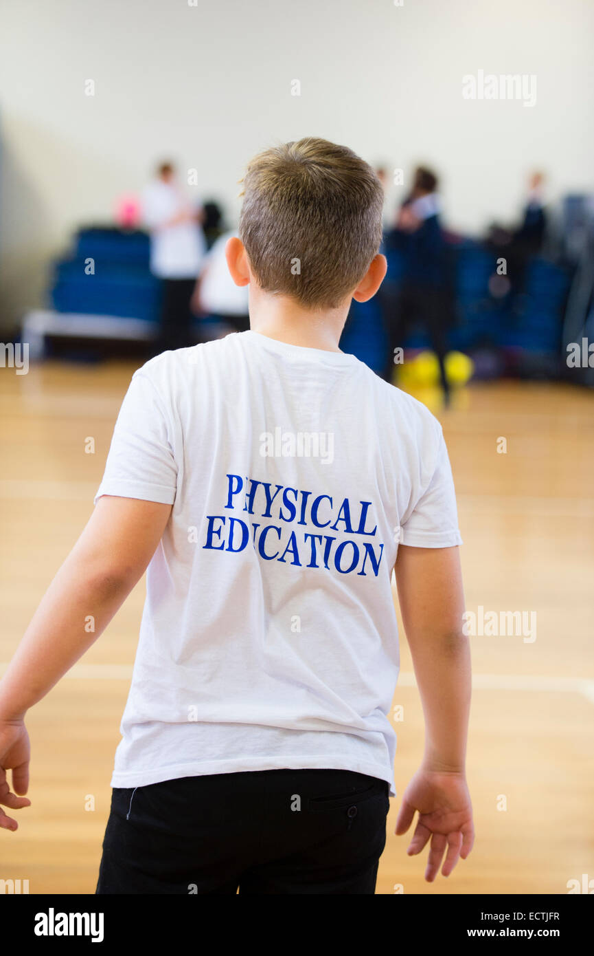 Secondary school physical education Wales UK:  rear view of a Year 9 - 10 boy child  in the school gymnasium at  lunchtime Stock Photo