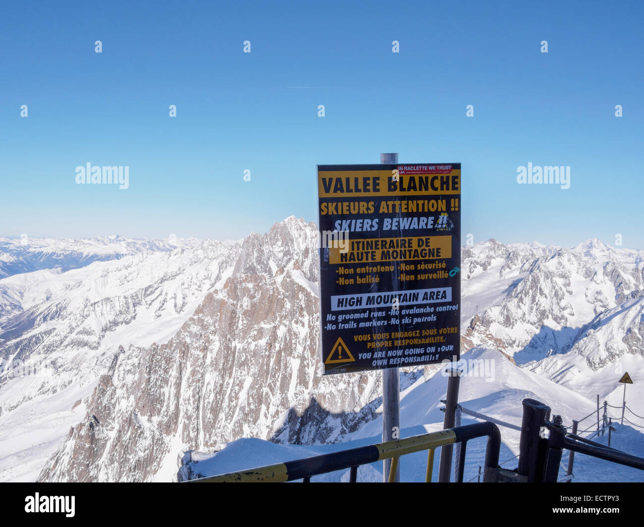 Warning sign for skiers by route to Vallee Blanche on Aiguille du Midi in French Alps. Chamonix-Mont-Blanc, Rhone-Alpes, France Stock Photo