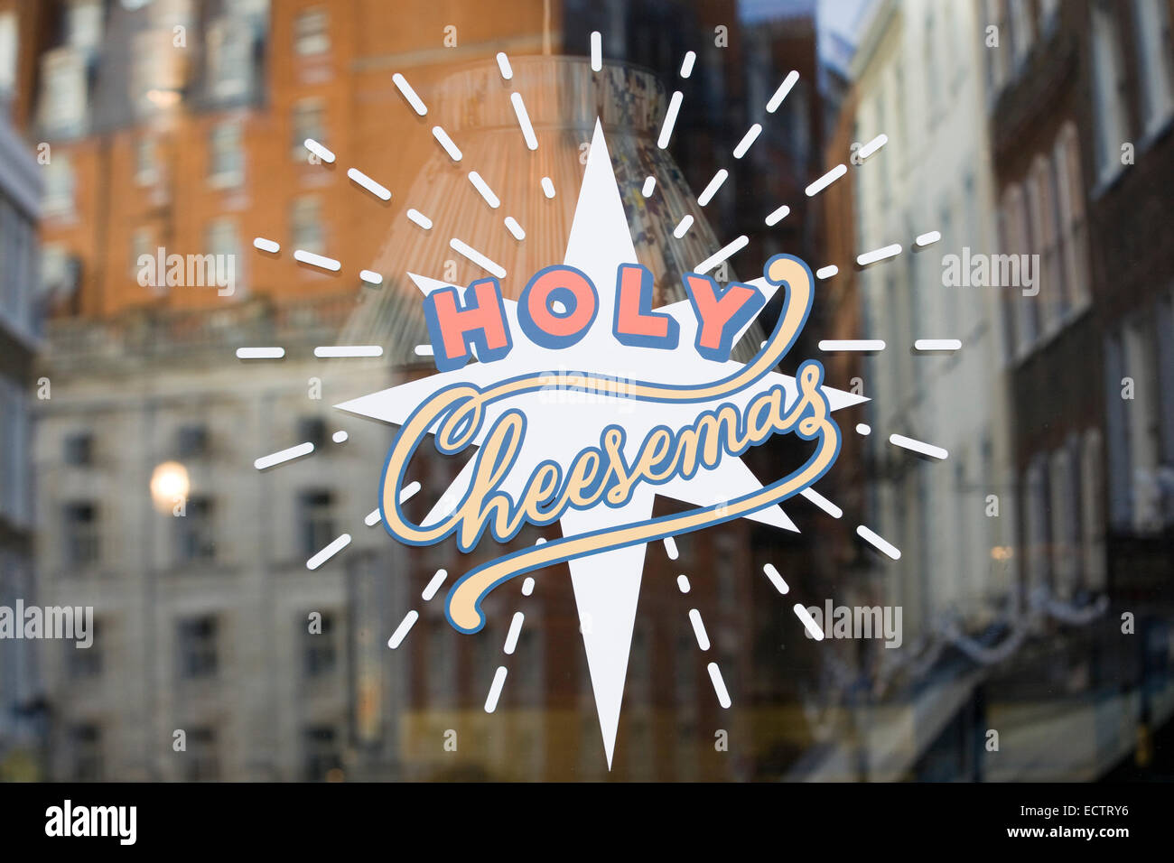 Window sticker with the Saying Holy Cheesemas Stock Photo