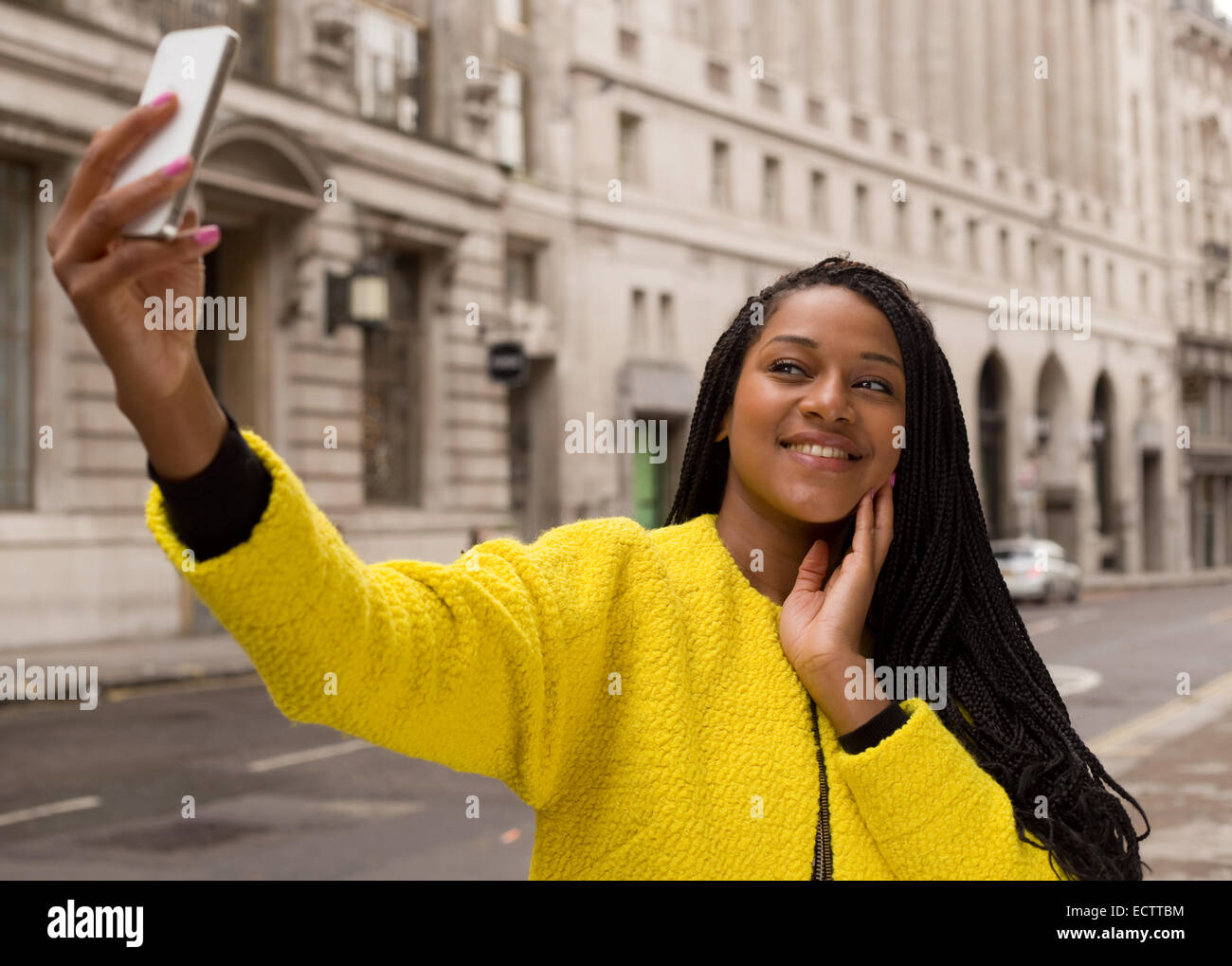 young woman taking a selfie in the street Stock Photo - Alamy
