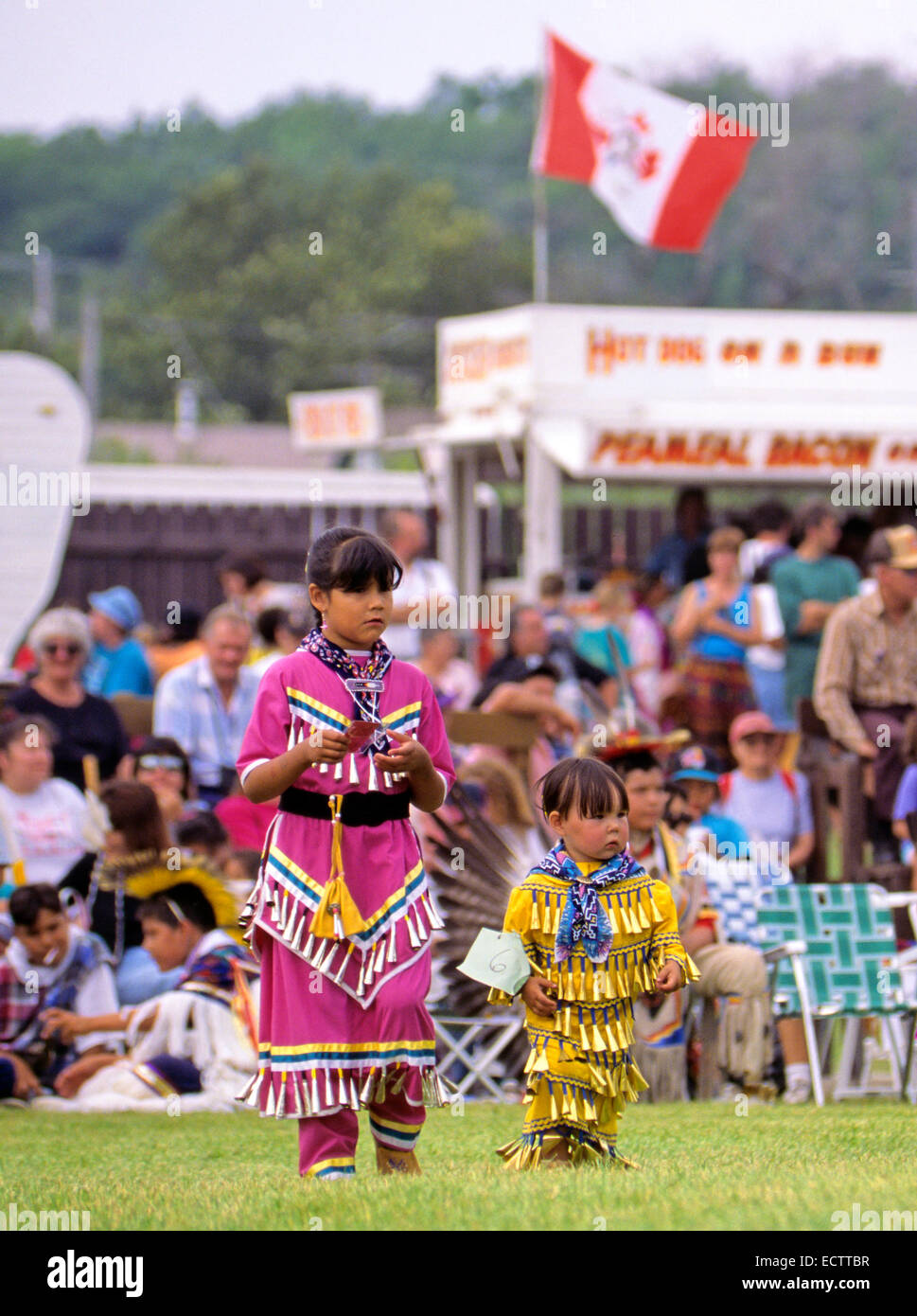 Young girls in jingle dresses participating in the a pow wow held on Manitoulin Island, Ontario, Canada. Stock Photo