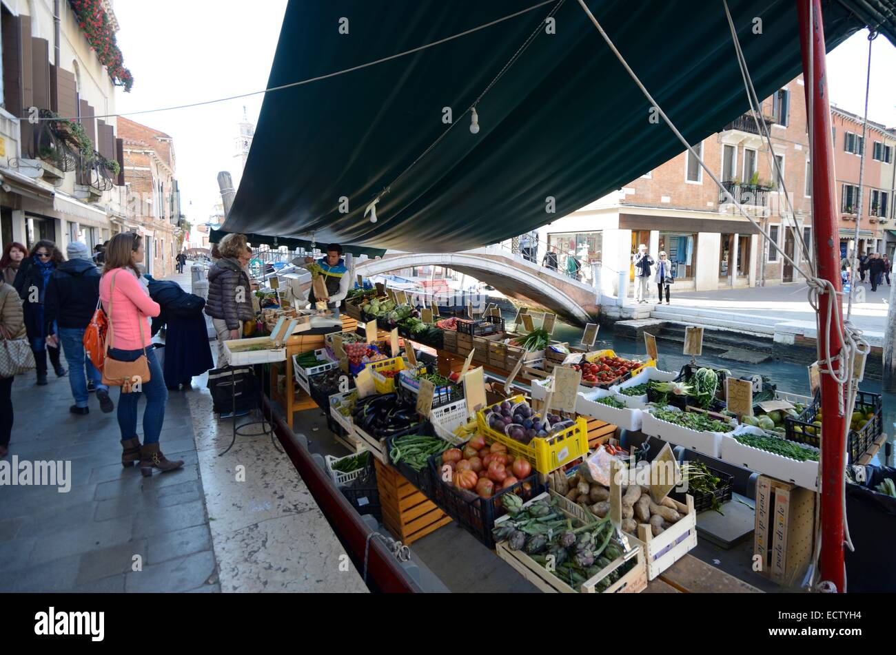 Fruit and vegetable market on a colourful, busy Venice canal Stock Photo