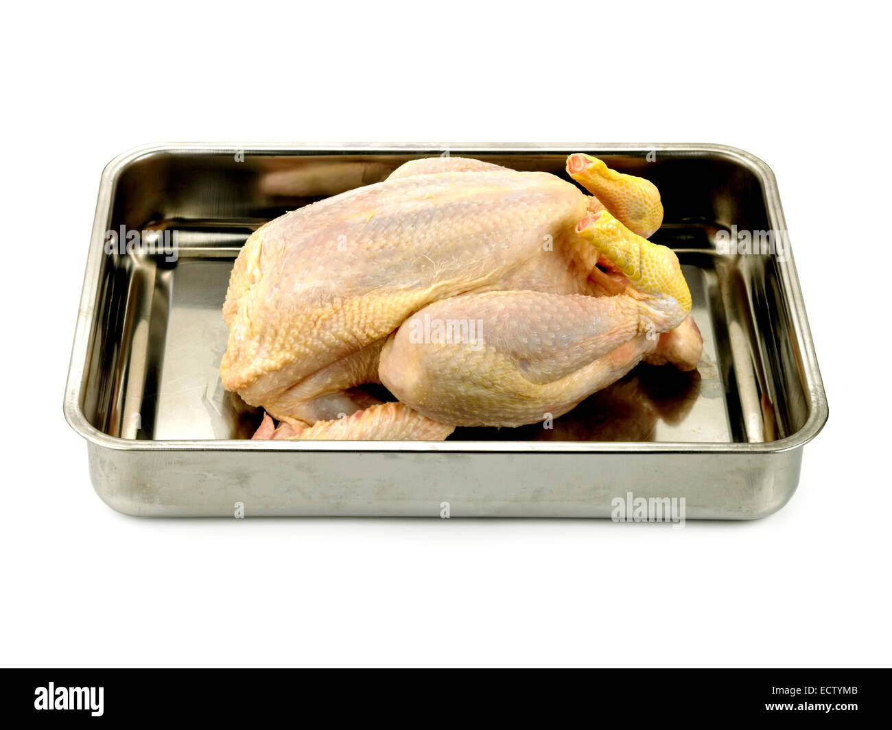 uncooked chicken in roasting tin Stock Photo