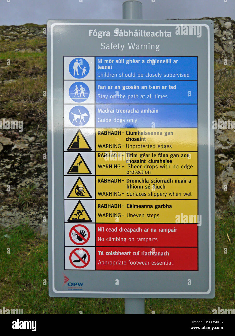 Bilingual (Irish and English) safety warning sign at Castledonovan, near Drimoleague, County Cork, Ireland. Stock Photo