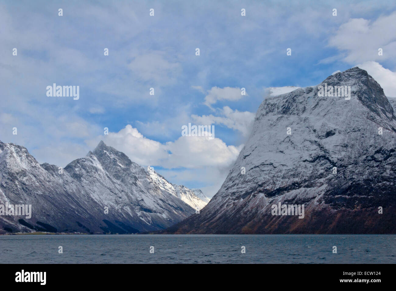 Winter in Norway with snow on mountains. Blistering cold fjord beneatgh Stock Photo
