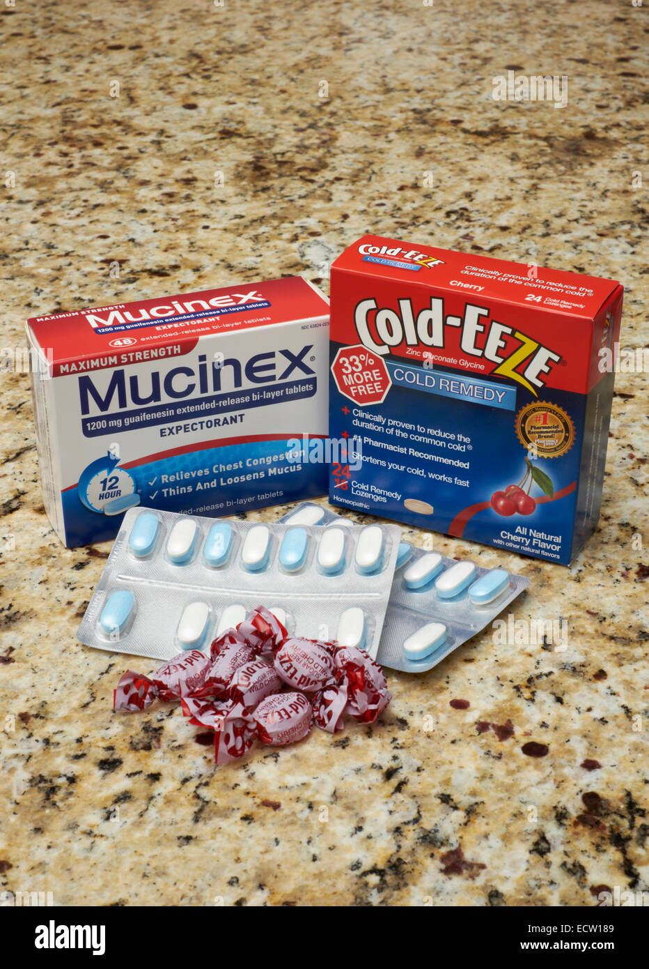 Two popular cold and flu medications on a kitchen counter top; Mucinex and Cold-Eeze. Stock Photo