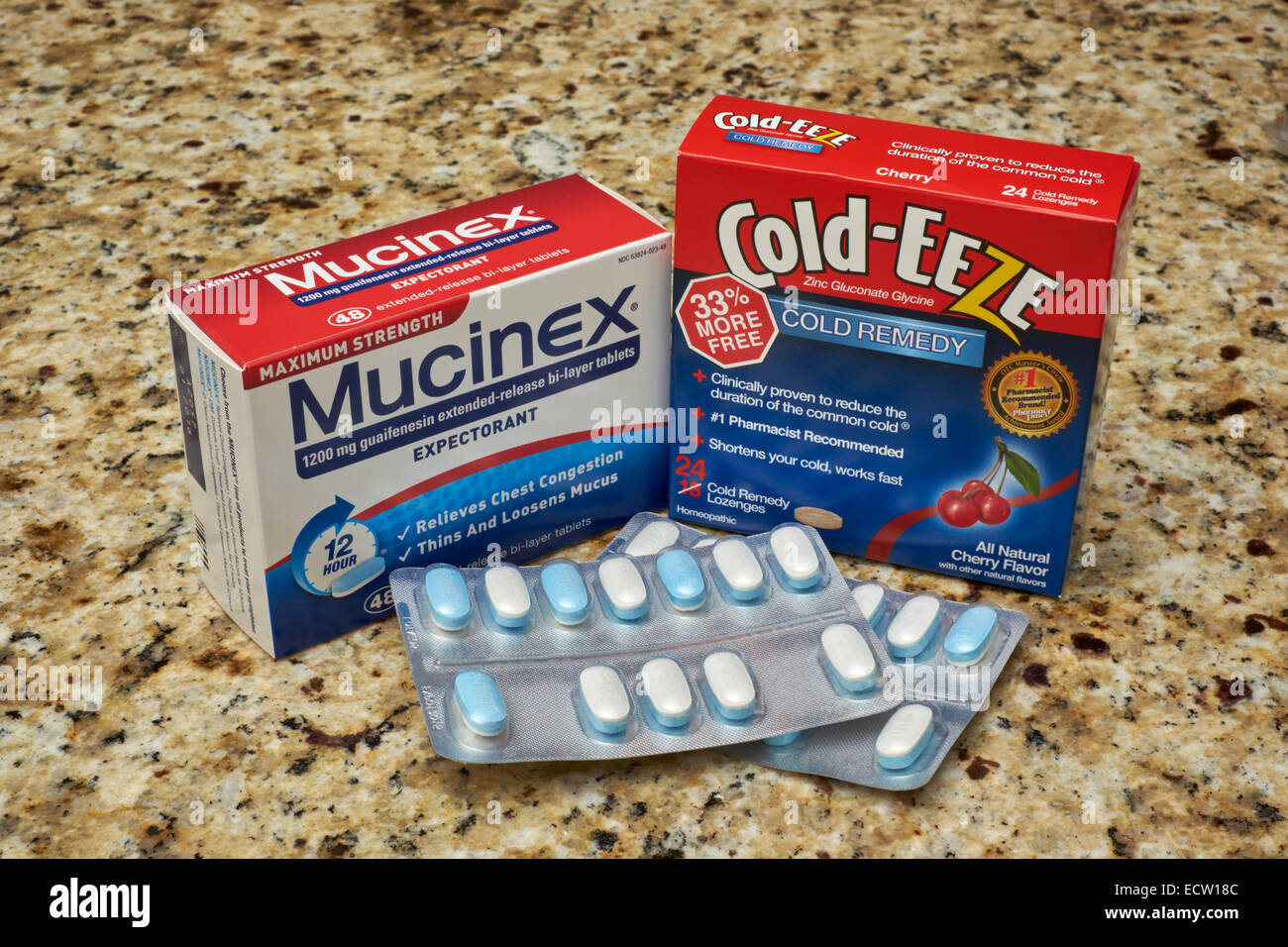Two popular cold and flu medications on a kitchen counter top; Mucinex and Cold-Eeze. Stock Photo