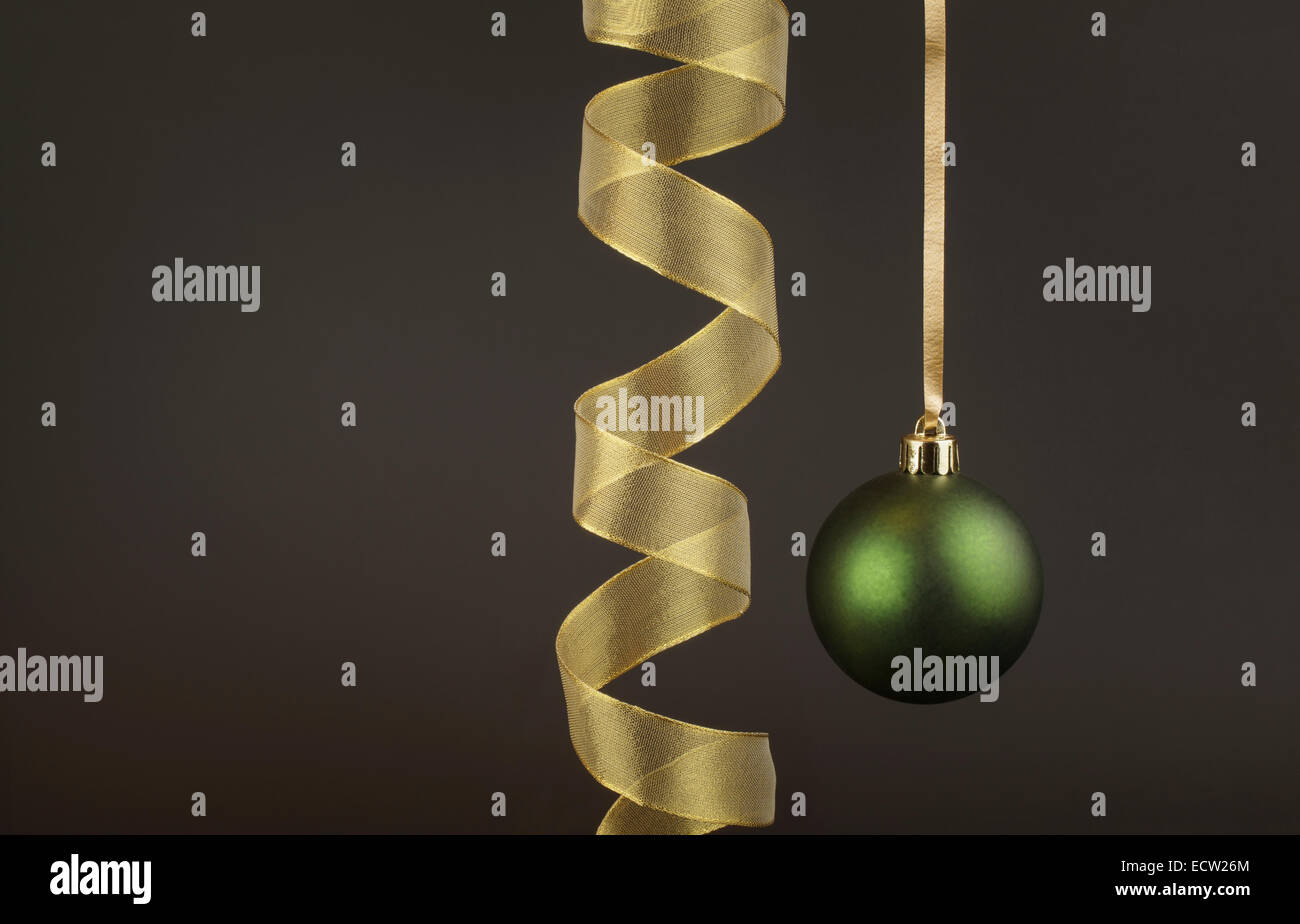 Green Christmas Bauble with a gold Ribbon Stock Photo