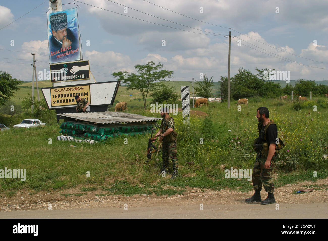 Entrance to the village of Tsentoroi, Chechnya, Russia. Under a photograph of the assassinated former Chechen president Akhmad Kadyrov a sign says 'No to drug addiction', and another 'Death to terrorists and wahhabites'. Stock Photo