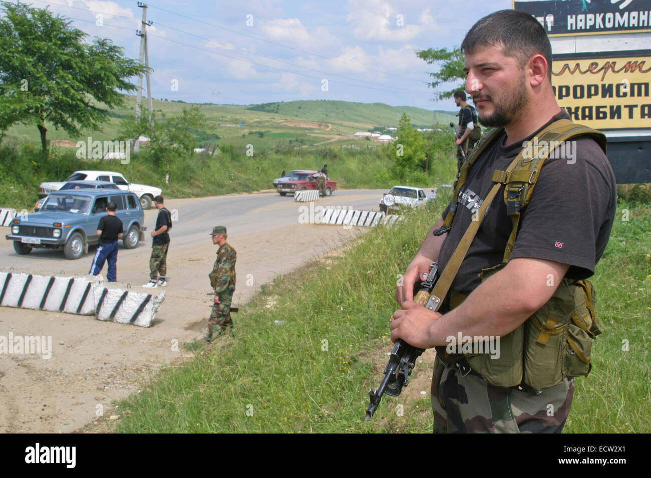 Members of the militia of Chechen leader Ramzan Kadyrov, the later president, at the entrance to the village of Tsentoroi, Chechnya, Russia. Stock Photo