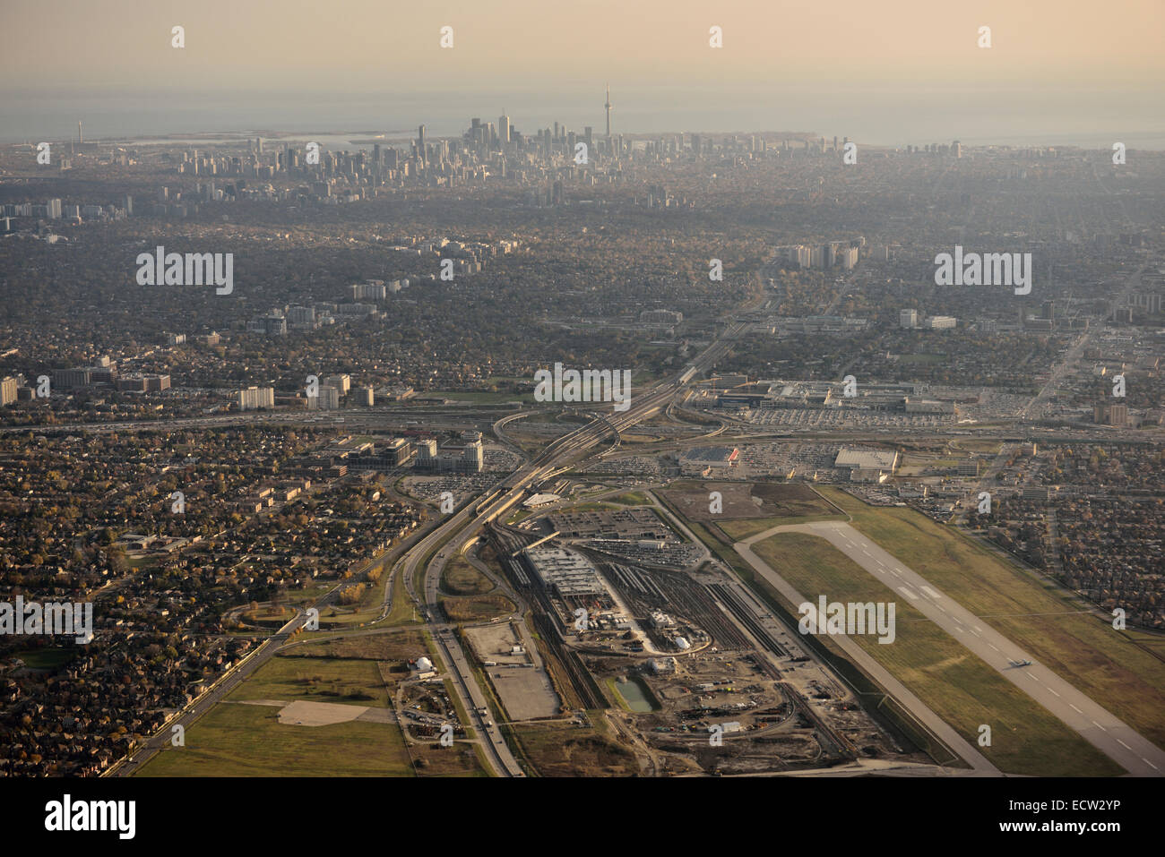 Aerial view of Downsview Airport and Yorkdale Shopping Centre in North York with Toronto city skyline of highrise towers Stock Photo