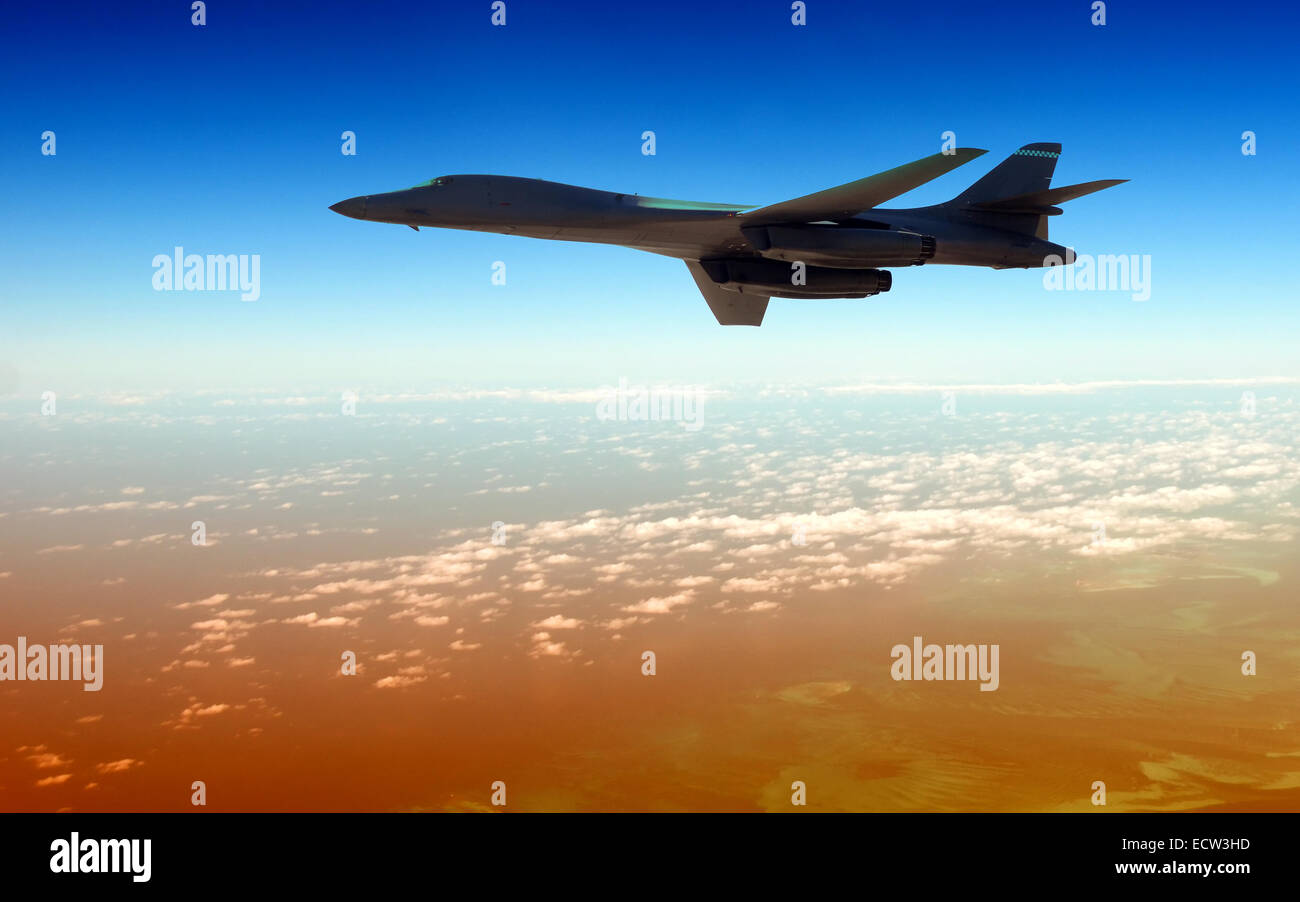 Modern strategic B-1B bomber flying high in twilight Stock Photo