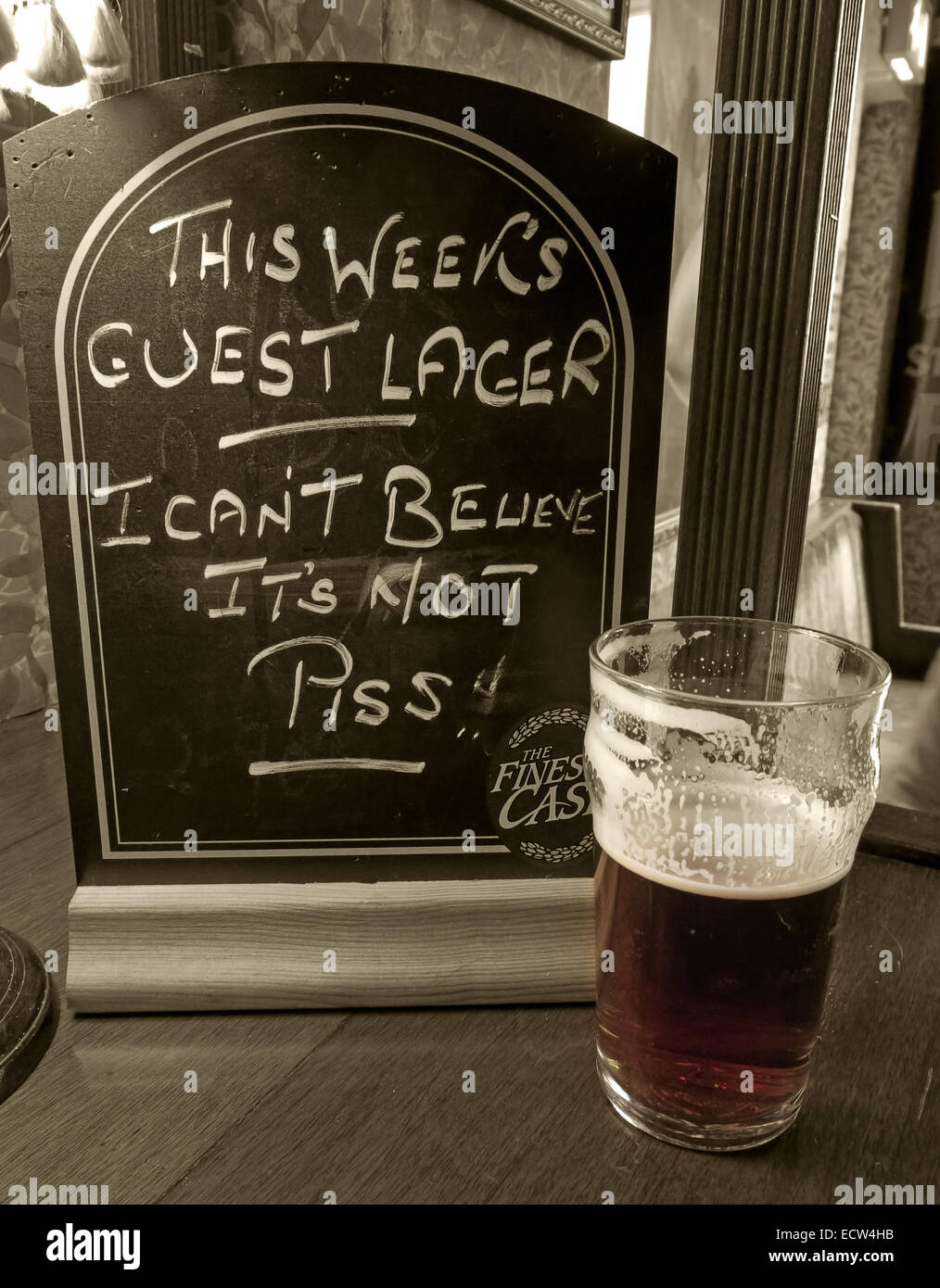 Sepia sign 'This weeks Guest Lager I Cant believe its not piss' in a real ale CAMRA bar, Chester, England, Great Britain UK Stock Photo