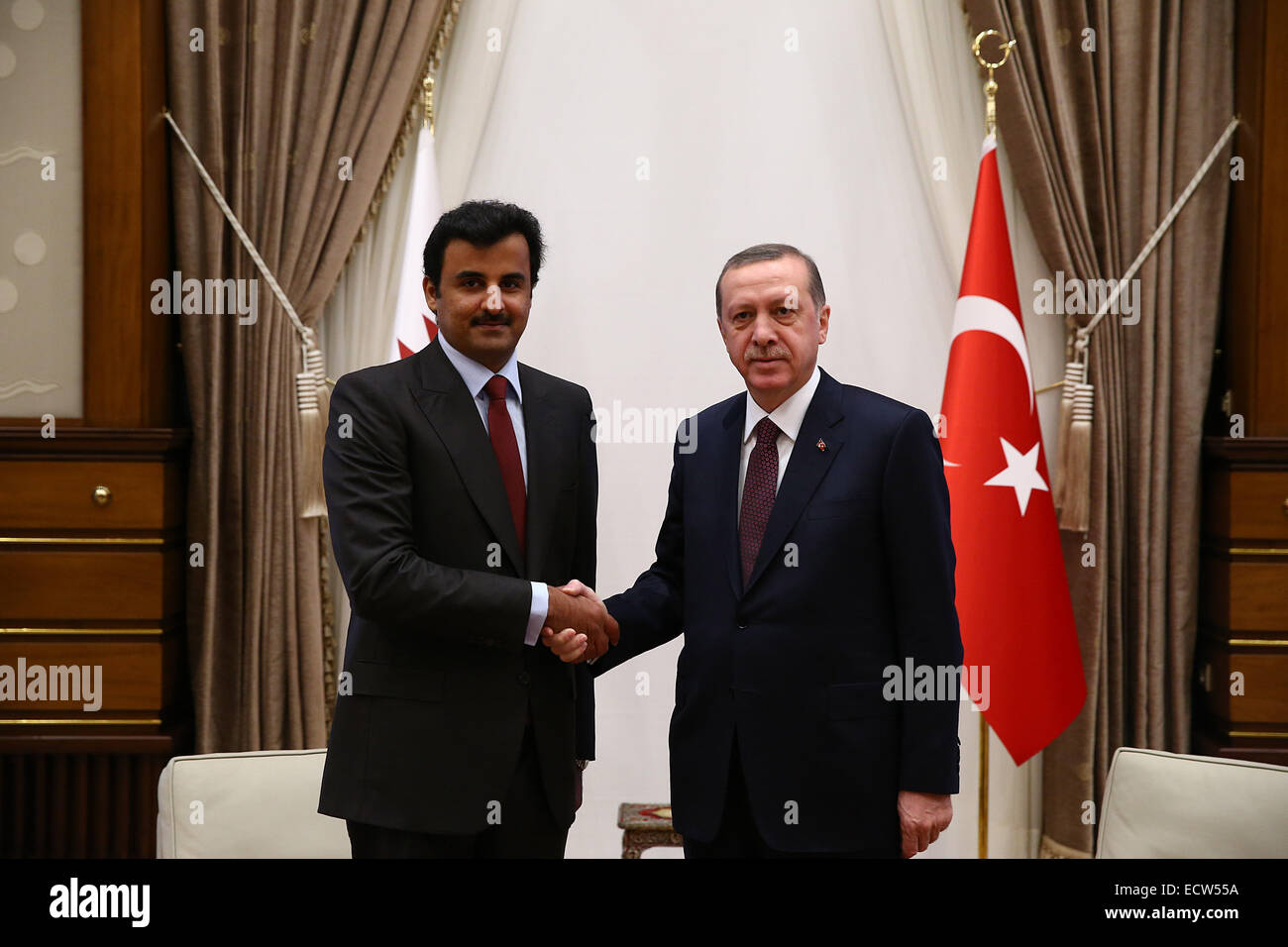 Ankara, Turkey. 19th Dec, 2014. Turkish President Recep Tayyp Erdogan (R) meets with visiting Qatar's Emir Sheikh Tamim bin Hamad Al Thani in the new Turkish Presidential Palace in Ankara, Turkey, on Dec. 19, 2014. Turkey and Qatar on Friday signed an agreement for the establishment of 'Strategic Committee' in order to intensify their already growing relations. Credit:  Turkish Presidential Palace/Xinhua/Alamy Live News Stock Photo