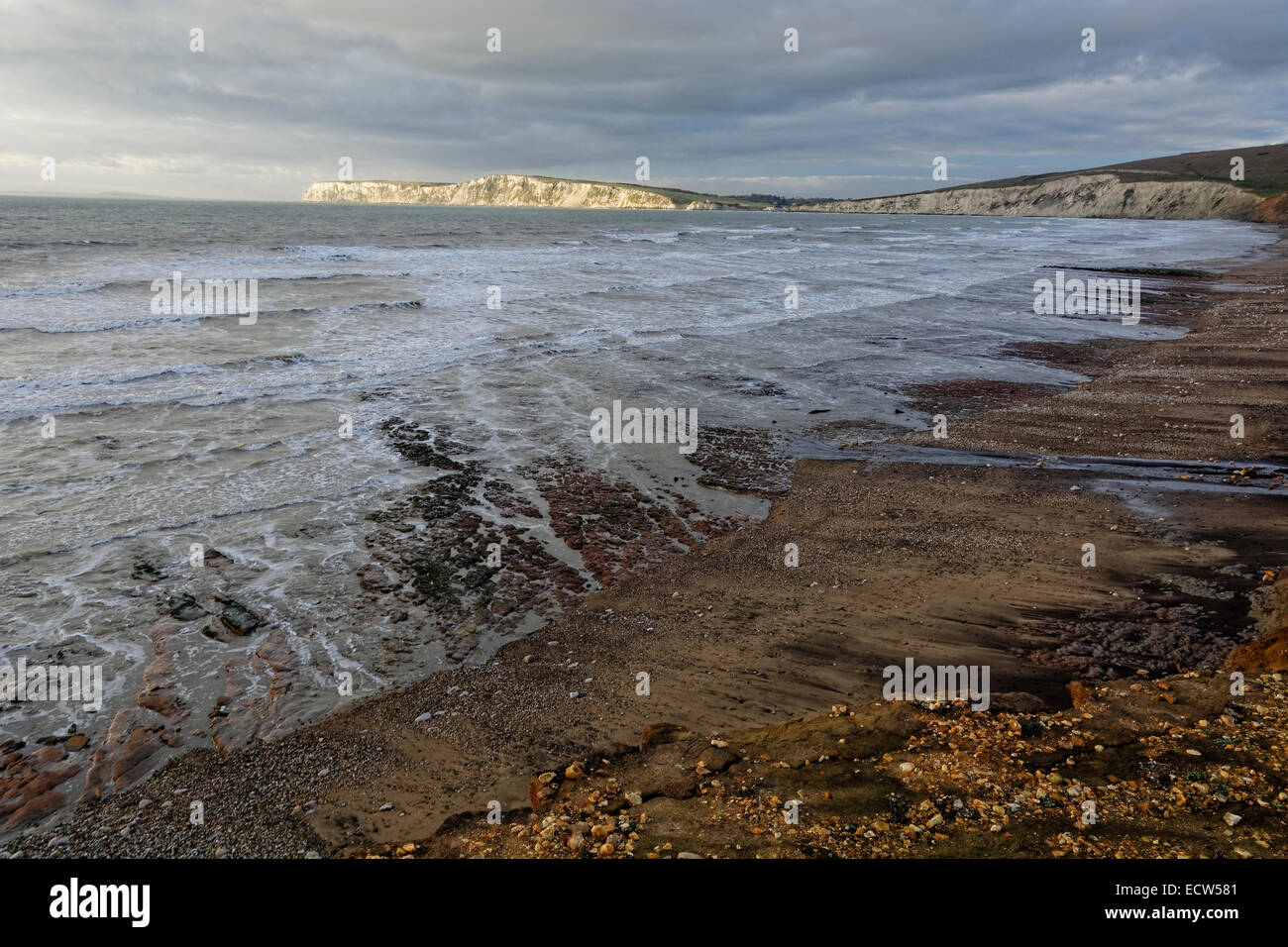 Looking westwards across Compton Bay at low tide under leaden skies