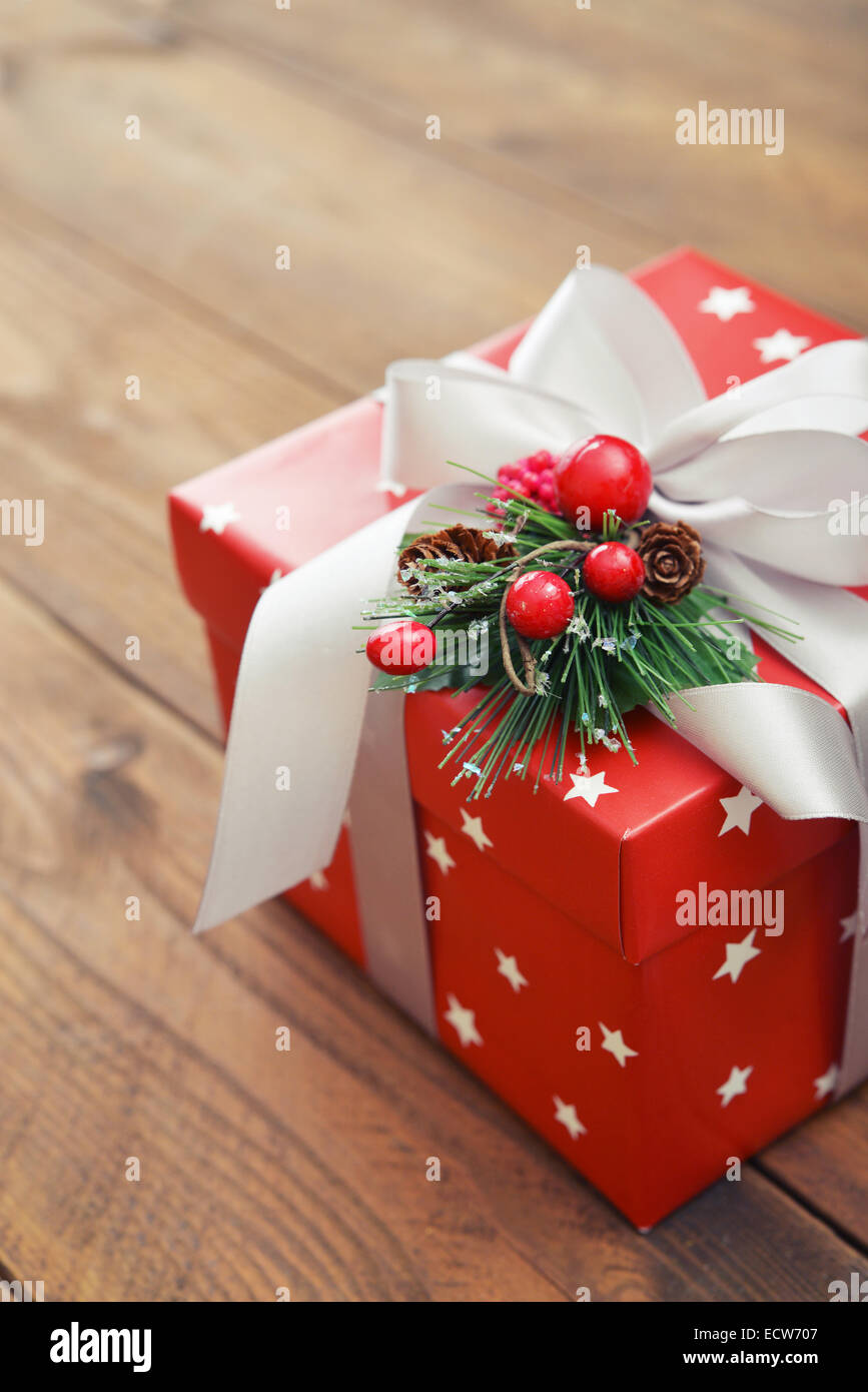 Christmas present wrapped in decorative wrapping paper with ribbon ...