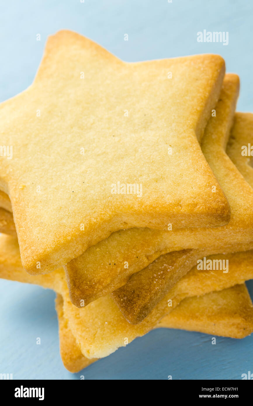 Sugar cookies in shape eof stars on blue background. Stock Photo
